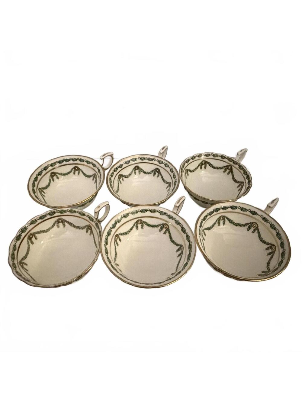 Set of six Hammersley bone china teacups with green garland and gold trim.